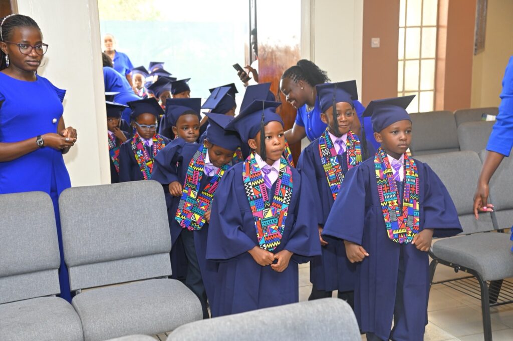 PP2 graduates in blue gowns walking in at Kings International Academy Graduation 2026