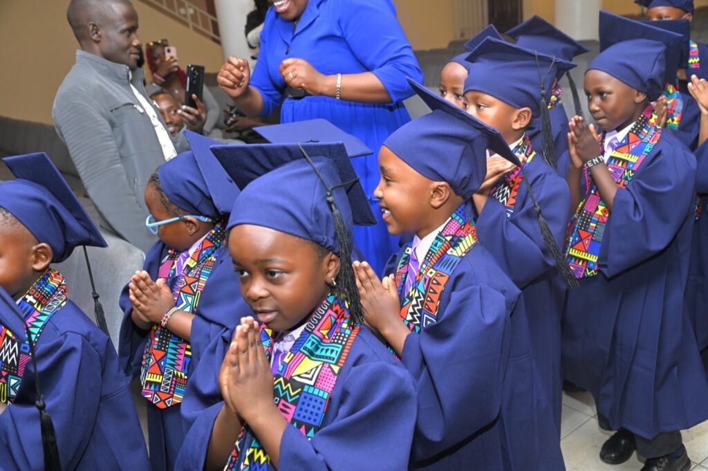 PP2 graduates clapping as they enter the graduation hall