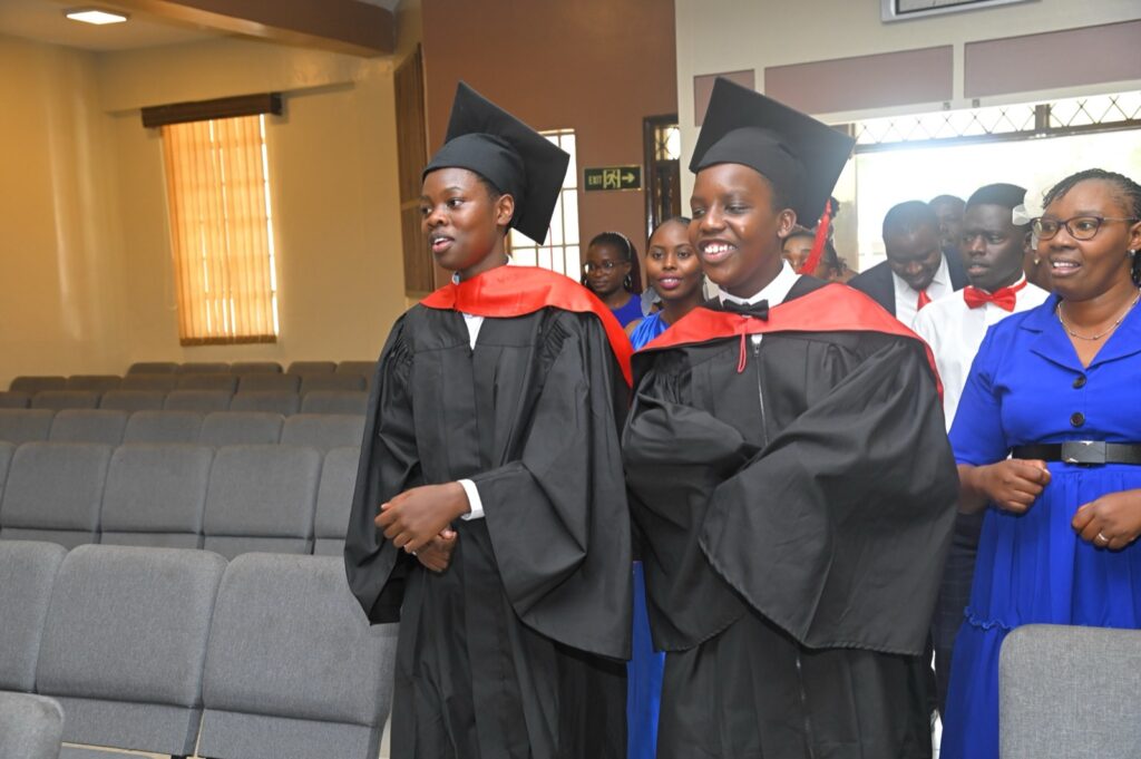 Grade 9 graduates in gowns and hoods at the 2026 graduation
