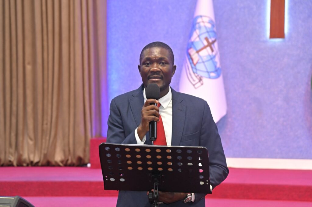 A guest addressing graduates and parents at Kings International Academy