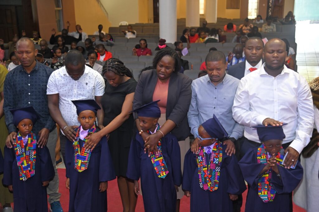 Parents with PP2 graduates during the blessing