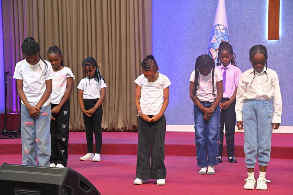 Learners dancing on stage at Kings International Academy