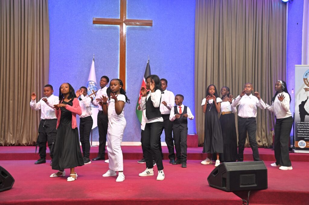 Grade 9 graduates dancing on stage
