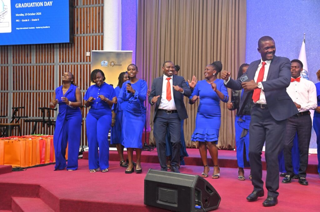 Teachers and staff on stage at the graduation