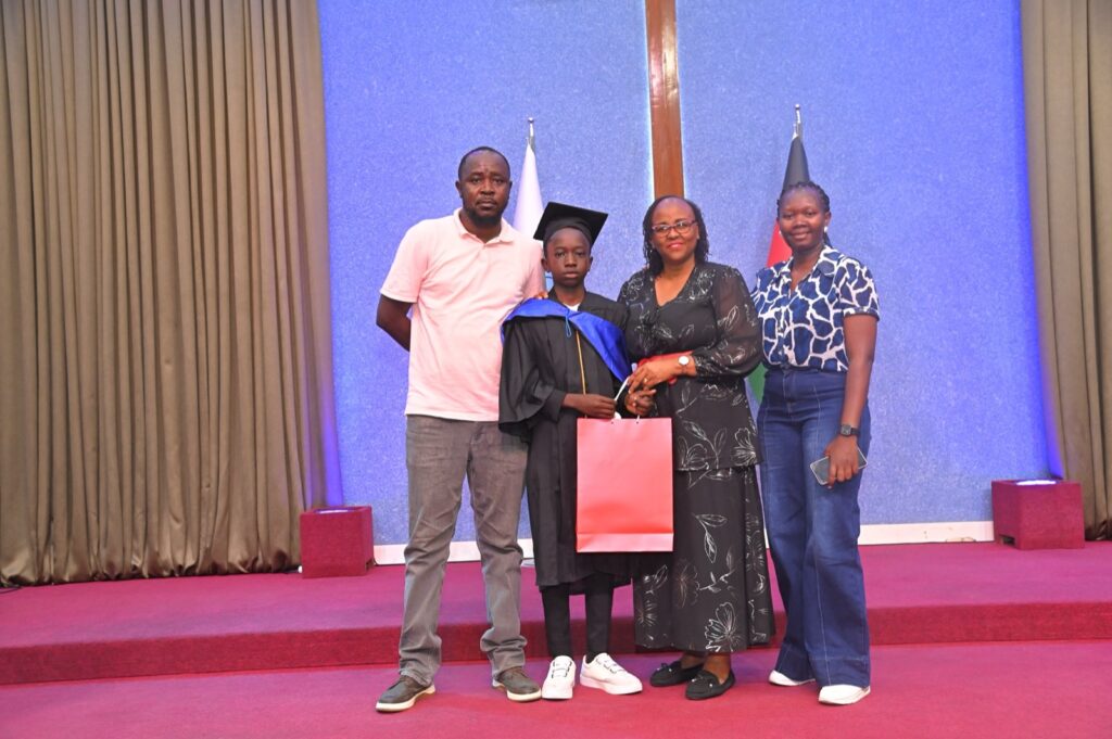 A Grade 9 graduate receiving a certificate
